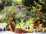 Summery Floral Decoration with Vine Tomatoes Photographic Print by Roland Krieg