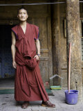 Young Buddhist Monk Outside a Doorway, Qinghai, China Photographie par David Evans