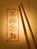Wooden Chopsticks on Paper with Asian Characters Fotografie-Druck von Misha Vetter