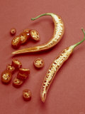 A Halved Chili Pepper and Slices of Chili Photographic Print by Axel Struwe