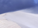 Winds Blast Across the Peak of a White Sand Dune, Wisping Away Sand, Australia Photographie par Jason Edwards