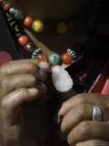 Woman Wearing a Traditional Bead and Jade Necklace and a Ring, Qinghai, China Photographie par David Evans