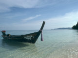 Wooden Boat Named Paradise is Tethered to a Palm Tree Photographic Print by Kate Thompson