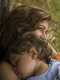 Woman with Her Sleeping Child at Anahola Beach, Hawaii Photographic Print by Bill Hatcher