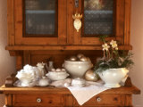 White Crockery with Christmas Decoration on Kitchen Cabinet Photographic Print by Roland Krieg