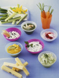 Six Different Dips, Strips of Cheese and Raw Vegetables Photographic Print by Jörn Rynio