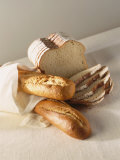 Partly Sliced Bread and Baguettes Photographic Print by Diana Miller