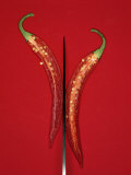 A Red Chili Pepper Sliced in Half Fotografie-Druck von Jan-peter Westermann