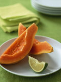 Two Papaya Wedges on a Plate Photographic Print by Michael Paul