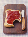 Bread with Butter & Strawberry Jam on Chopping Board Lámina fotográfica