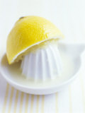 Lemon Half on Lemon Squeezer Photographic Print by Maja Smend