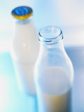 Two Milk Bottles, One Opened Photographic Print by Klaus Arras