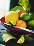 A Selection of Citrus Fruits in a Bowl Photographic Print