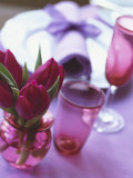 Red Tulips in Small Vase Beside Place Setting Photographic Print by Michael Paul