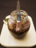 Chocolate Spread in Jar with Knife Photographie par Anita Oberhauser
