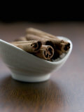 Cinnamon Sticks in Small Bowl Photographic Print by Henrik Freek