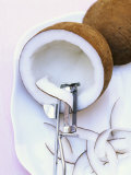 Making Coconut Shavings with a Vegetable Peeler Fotografisk trykk av Nikolai Buroh