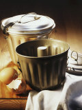 Pudding Moulds on Wooden Table Photographic Print by Martina Urban