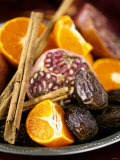 Mandarin Oranges, Dates, Pomegranate and Cinnamon Sticks Photographic Print by Ulrika Pousette