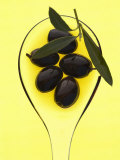 Black Olives in Olive Oil with Sprig of Olive Leaves Photographie par Marc O. Finley