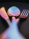 Knife, Fork and Spoon in Red and Blue Light Photographie par Vladimir Shulevsky