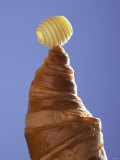 A Croissant with a Butter Curl Photographic Print by Marc O. Finley