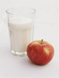 Glass of Milk and Red Apple Photographic Print by Roger Stowell