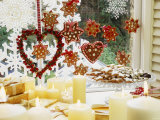 Christmassy Window Decorated with Biscuits and Candles Photographic Print by Linda Burgess