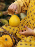 Girl Holding a Baby Pumpkin Photographic Print by Alena Hrbkova