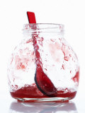 A Jar with Remains of Raspberry Jelly and Spoon Photographic Print by Marc O. Finley