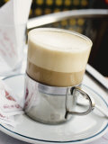 Latte Macchiato on Table in Cafe Photographic Print