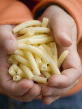 Child's Hands Holding Macaroni Photographic Print