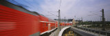 Train on Railroad Tracks, Central Station, Berlin, Germany Lámina fotográfica por Panoramic Images