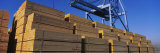 Stacks of Lumber at a Dock with a Crane Lámina fotográfica por Panoramic Images Stacks of Lumber at a Dock with a Crane Lámina fotográfica por Panoramic Images