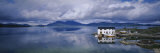 Clouds over a River, Kvernesfjorden, Kristiansund, Norway Lámina fotográfica por Panoramic Images Clouds over a River, Kvernesfjorden, Kristiansund, Norway Lámina fotográfica por Panoramic Images