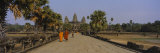 Two Monks Walking in Front of an Old Temple, Angkor Wat, Siem Reap, Cambodia Photographic Print by Panoramic Images 