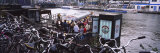 Bicycles Parked Next to a Channel, Amsterdam, Netherlands Photographic Print by Panoramic Images 