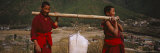 Two Monks Carrying a Sack of Sand on Their Shoulders, Dechen Phodrang, Thimphu, Bhutan Photographic Print by Panoramic Images 