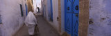 Woman Walking on the Street, Medina, Kairwan, Tunisia Photographic Print by Panoramic Images 