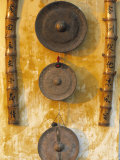 Gongs Hanging on a Wall, Vietnam Photographic Print by Peter Adams