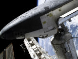 Space Shuttle Discovery Docked to the International Space Station Photographic Print by Stocktrek Images 