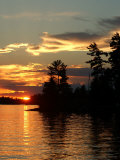Reflection on Lake of the Woods, Ontario, Canada Photographie par Keith Levit