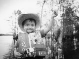 Boy with Fish Photographic Print by Kevin Leigh