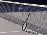Tennis Racquet Against Net with Ball Photographie par Mitch Diamond