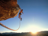 Rock Climber Dangling Off of Cliff Photographic Print by Greg Epperson