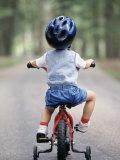 Little Boy Riding His Bicycle with Helmet Photographic Print by David Davis