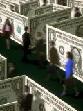 Businessman Walking Through Maze of Money Lámina fotográfica por Carol & Mike Werner