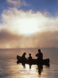 Silhouetted Father and Son Fishing from a Canoe Fotografie-Druck von Bob Winsett