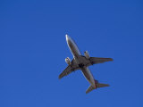 Commercial Airplane in Flight Photographic Print by Larry McManus