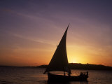 Silhouette of Sailing Boat Against Sunset, Kenya Photographic Print